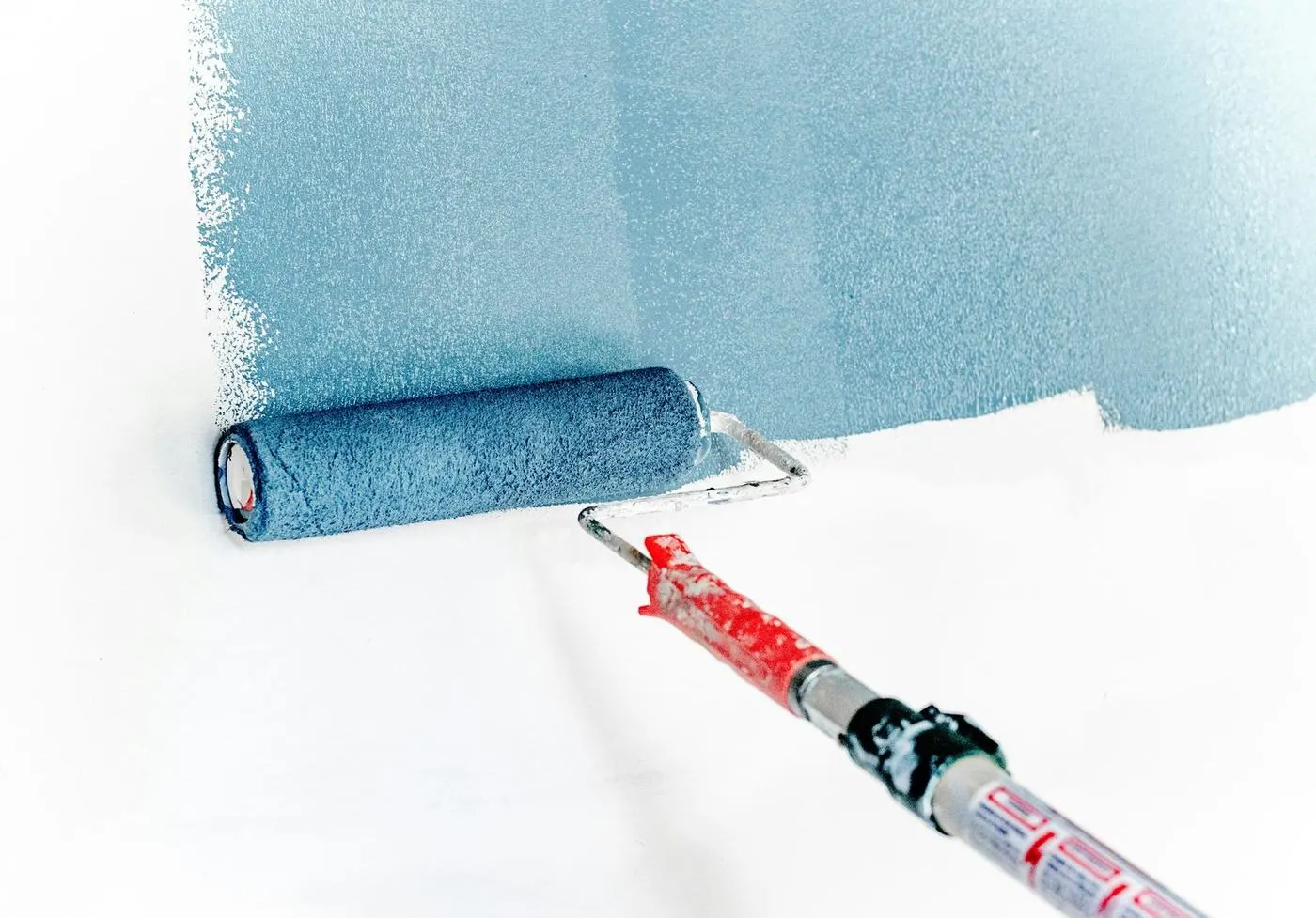 Interior wall being painted with a roller